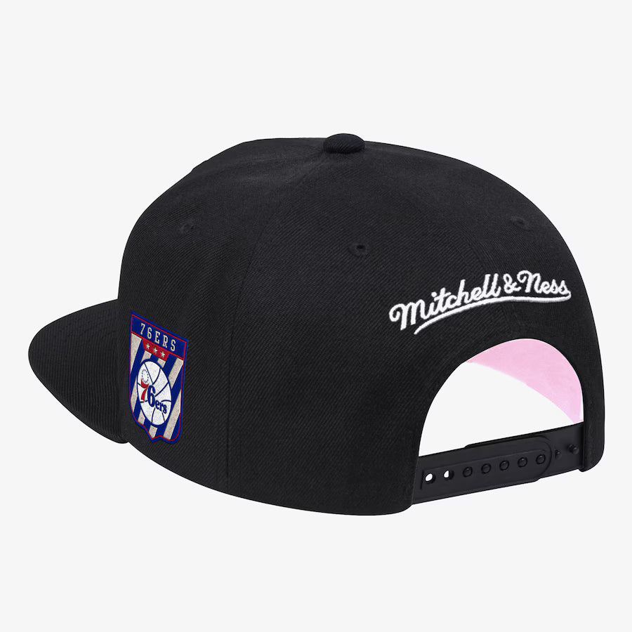 Display slide 1 of 3Selected slide 2 of 3Display slide 3 of 3 Black Philadelphia 76ers Hardwood Classics Pink Under Script Snapback Hat